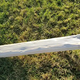 hail damaged downspout